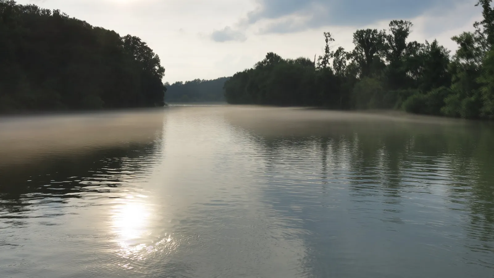 Calm, misty water on the Chattahoochee River above Morgan Falls Dam