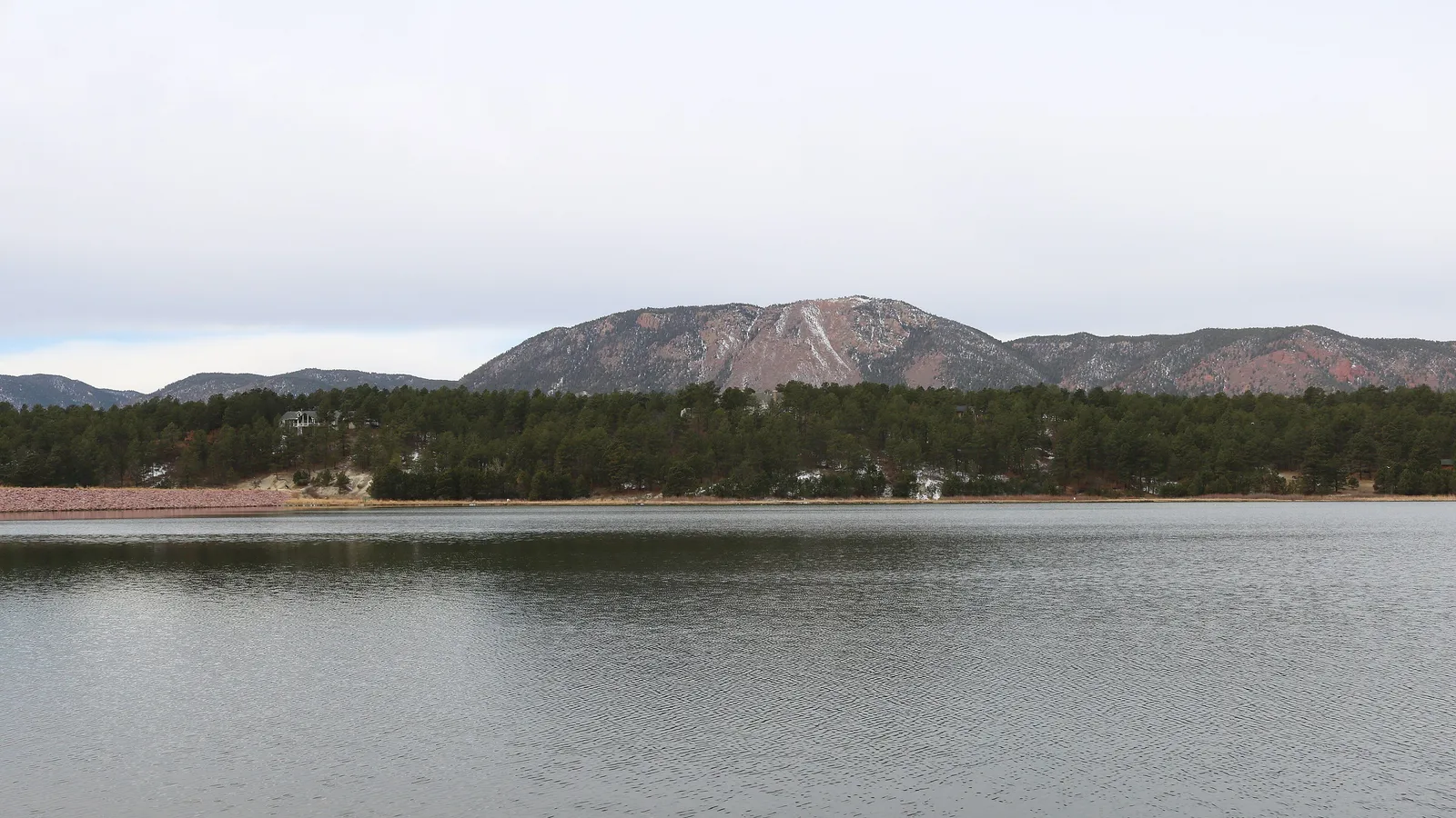 Calm water on Monument Lake with Mount Herman behind