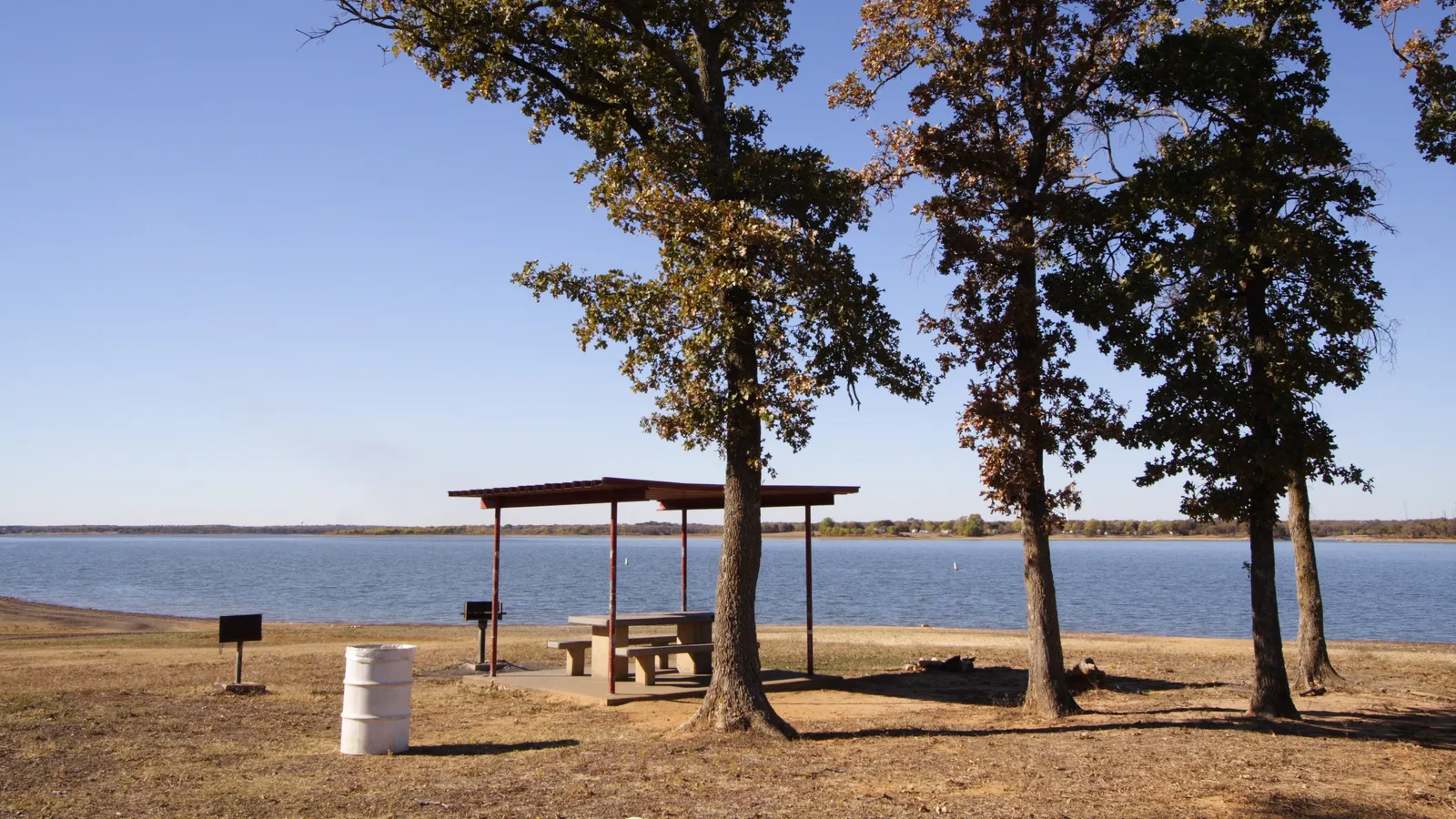 A shaded picnic area on the shore of Lewisville Lake