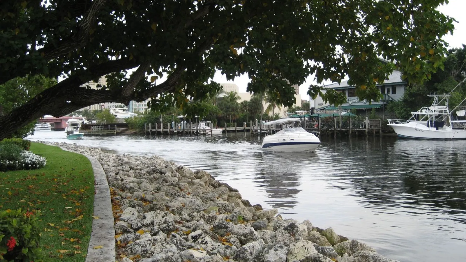 The New River curving past the Riverwalk in Fort Lauderdale, with boats at the docks