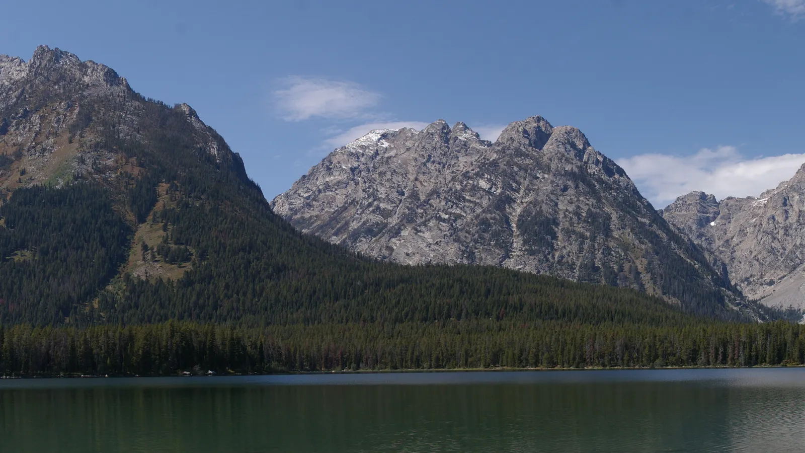 The south end of Leigh Lake below the forested slopes and granite peaks of the Teton Range