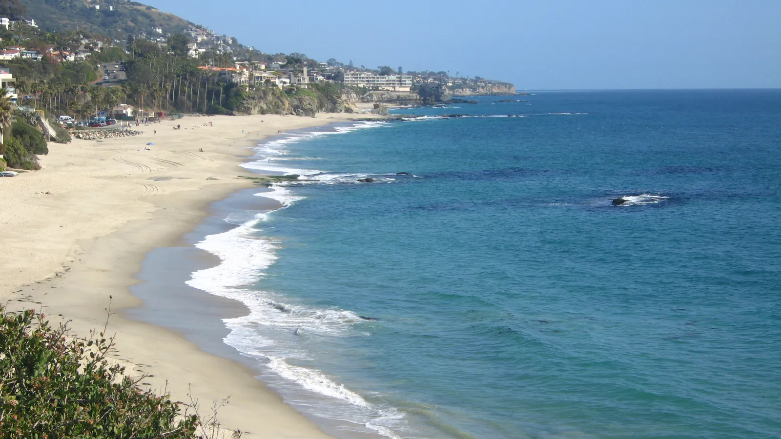 Aliso Beach in South Laguna, with waves breaking along the sand