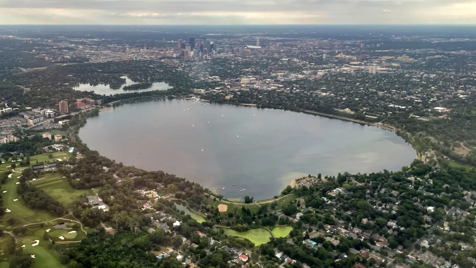 Aerial view of Bde Maka Ska with the Minneapolis skyline in the distance