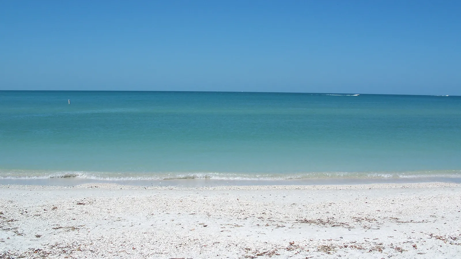 Clear turquoise Gulf water off the shell beach at Delnor-Wiggins Pass State Park