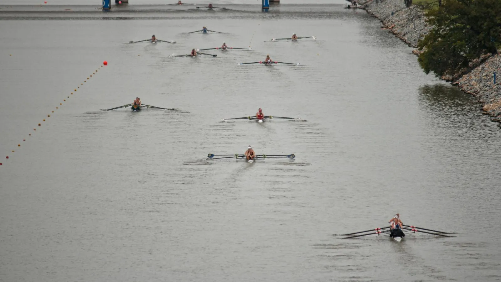 Rowers racing on the flat, buoyed course of the Oklahoma River