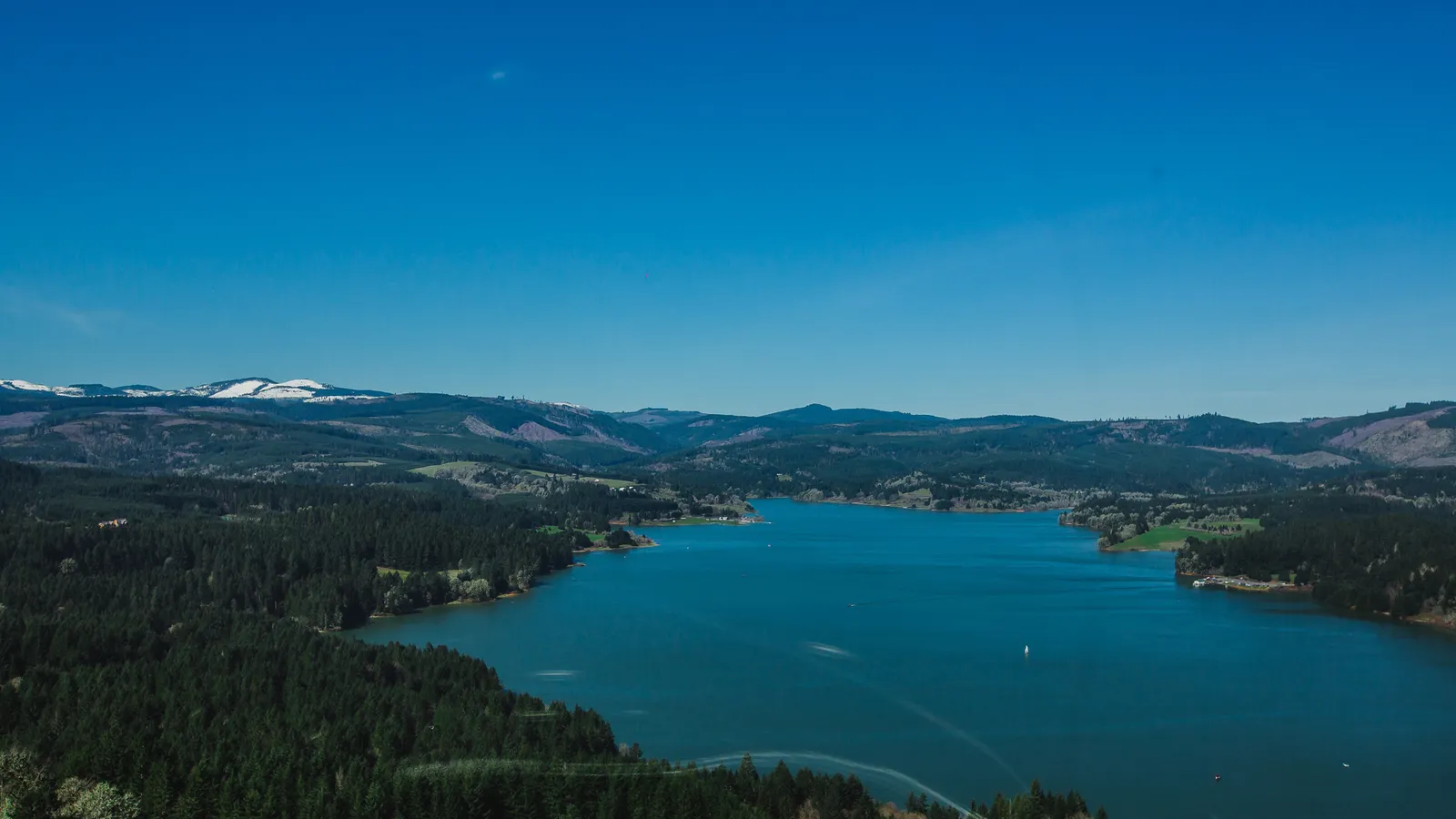 Aerial view of Henry Hagg Lake winding between forested Coast Range foothills