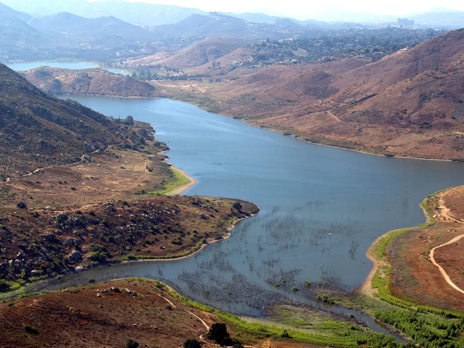 Lake Hodges winding between dry hills, seen from above