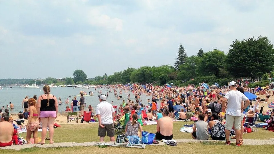 A crowded summer day at Clinch Park Beach on West Grand Traverse Bay