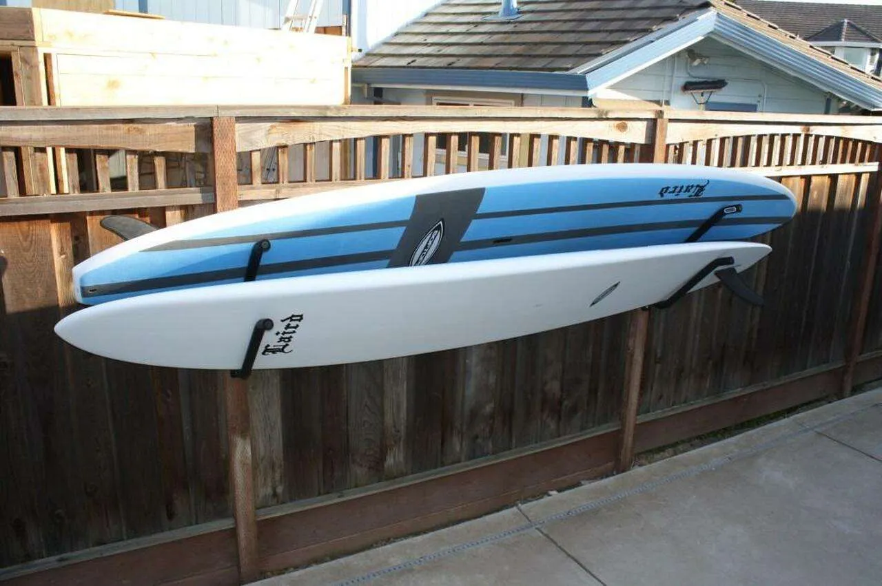 Paddle board stored outdoors under cover